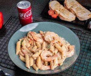 Creamy Cajun Shrimp Pasta served with garlic bread and drink (Choice of Pasta Penne, Farfalle, Fettuccini, Fussili, Spaghetti)